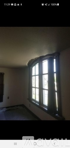 A room with a window and a door.