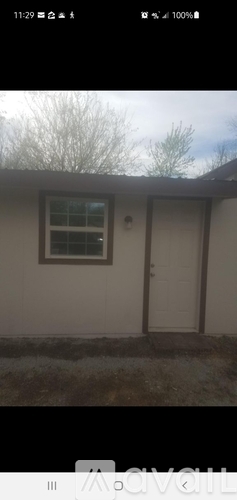 A house with a white door and window.