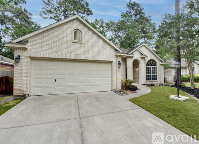 A house with a white garage door is for sale.