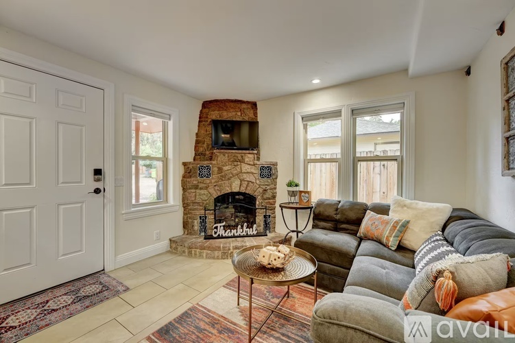 A living room with a fireplace and a couch.