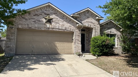A house with a garage and a star on the roof.