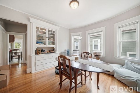 A dining room with a table and chairs is shown.