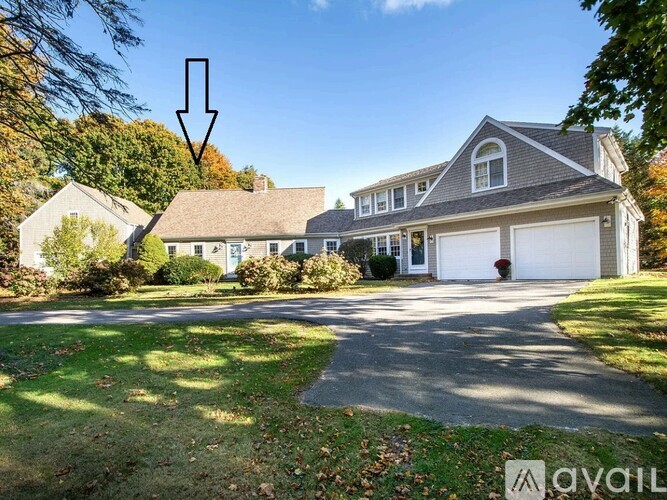 A large house with a driveway in front of it.