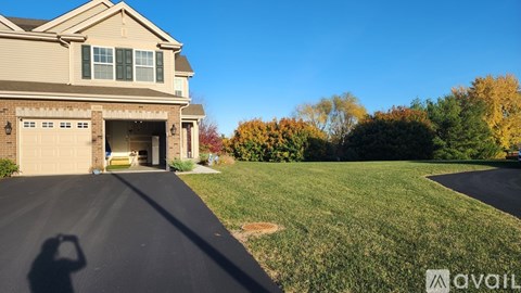 A house with a driveway in front of it.