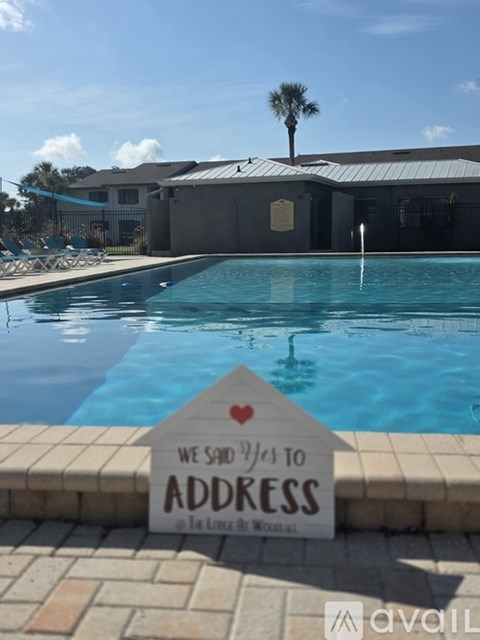 A pool with a sign that says "We said yes to address".