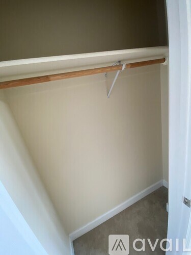 A white door with a handle is open.