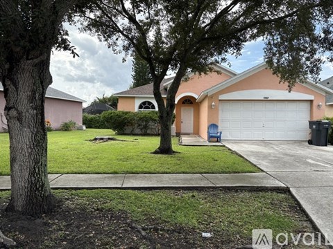 A house with a tree in front of it.