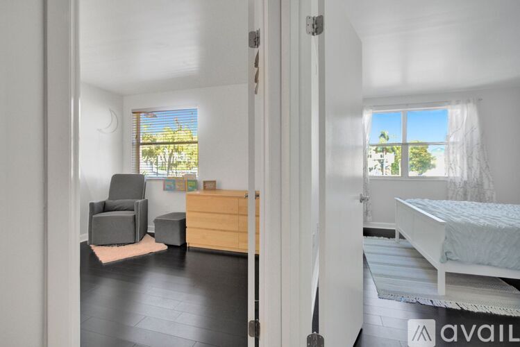 A bedroom with a bed, chair, and dresser is available for rent.