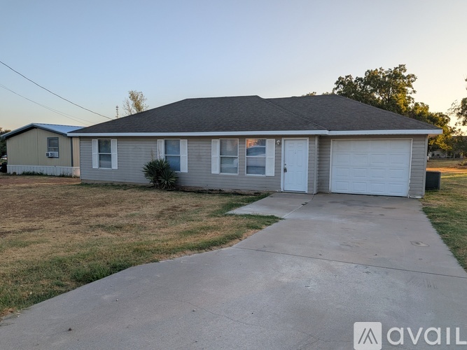 A house with a garage is available for sale.