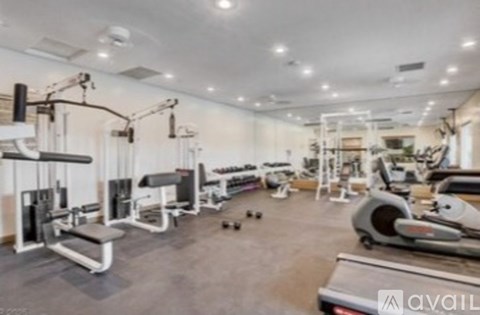 A gym with various exercise equipment is available for use.