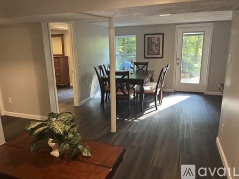 A dining room with a table and chairs is shown.