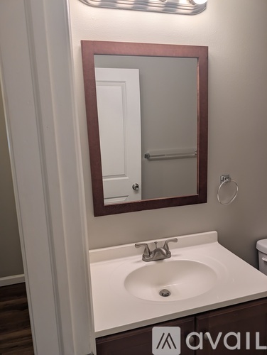 A bathroom sink with a mirror above it.