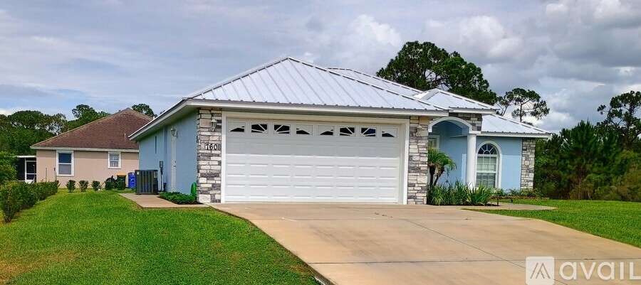 A house with a garage is for sale.