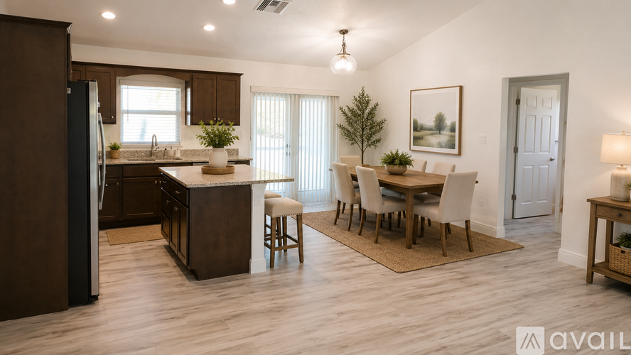 A kitchen with brown cabinets and a dining table with chairs.