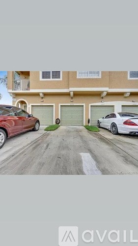 Two cars parked in front of a building with the word "available" written on the bottom.