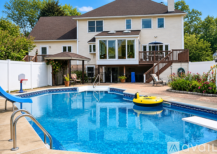 A large house with a pool in the backyard.