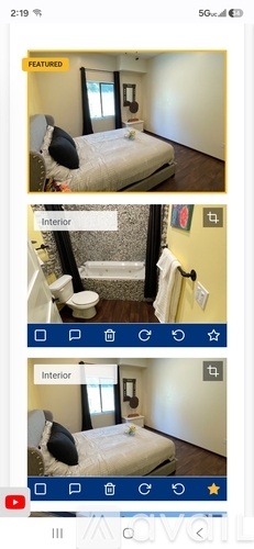 A bedroom with a bed, a toilet, and a window.
