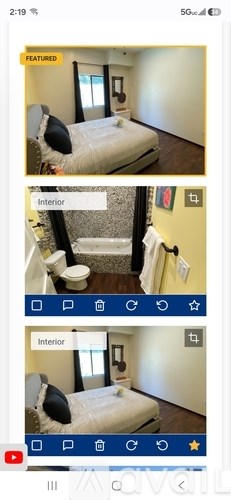A bedroom with a bed, a toilet, and a window.