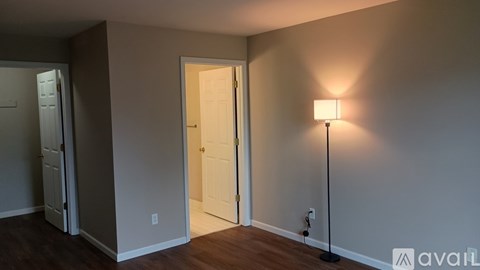 A small laundry room with a washer and dryer.