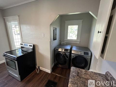 A kitchen with a black oven and a black dishwasher.
