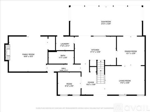 A floor plan of a house with a living room, dining room, kitchen, bathroom, and laundry area.