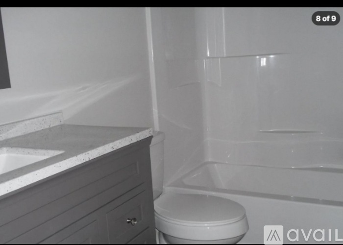 A bathroom with a toilet and a bathtub.
