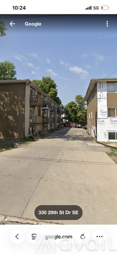 A street view of 330 29th St SE with apartment buildings on both sides.