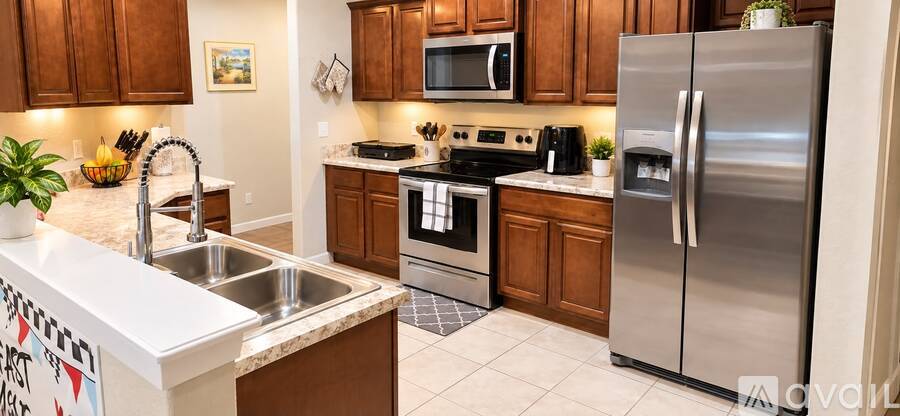 A kitchen with wooden cabinets and stainless steel appliances.