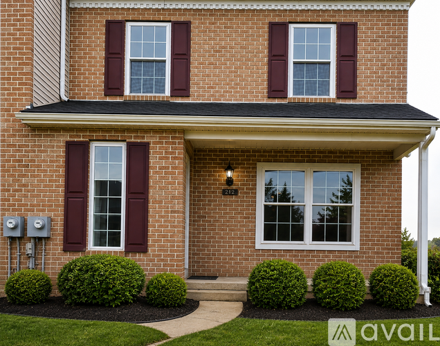 A house with red shutters and a brick facade.