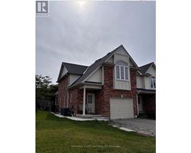 A house with a brick facade and a white garage door.
