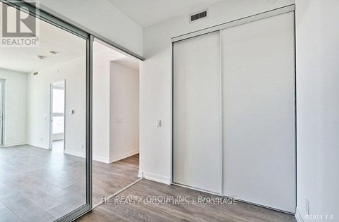 A room with a sliding door and a glass wall.
