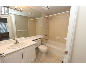 A bathroom with a sink, toilet and bathtub.