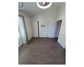 A room with a wooden floor and a white ceiling.