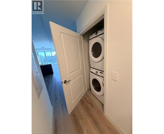 A washer and dryer are tucked into a small space in a home.