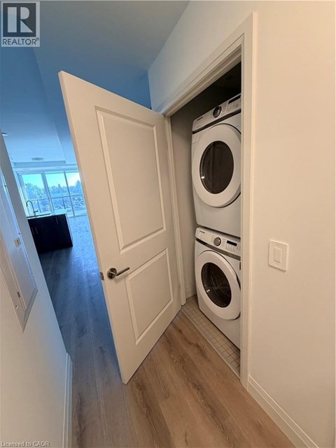 A washer and dryer are tucked into a small space in a home.