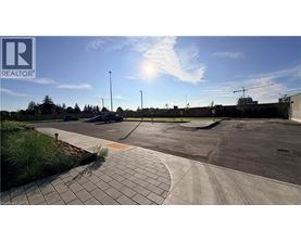 A sunny day at a parking lot with a clear blue sky.