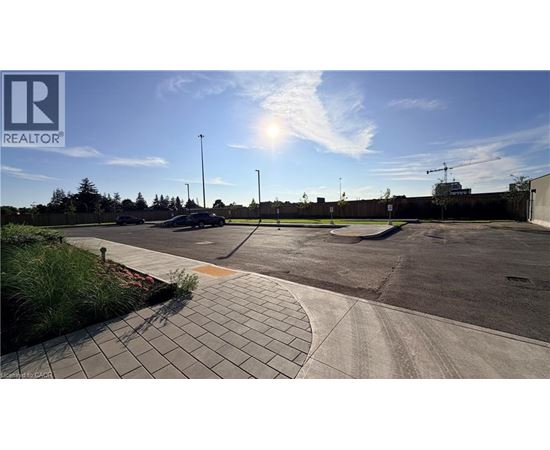 A sunny day at a parking lot with a clear blue sky.