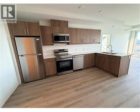 A kitchen with wooden cabinets and stainless steel appliances.