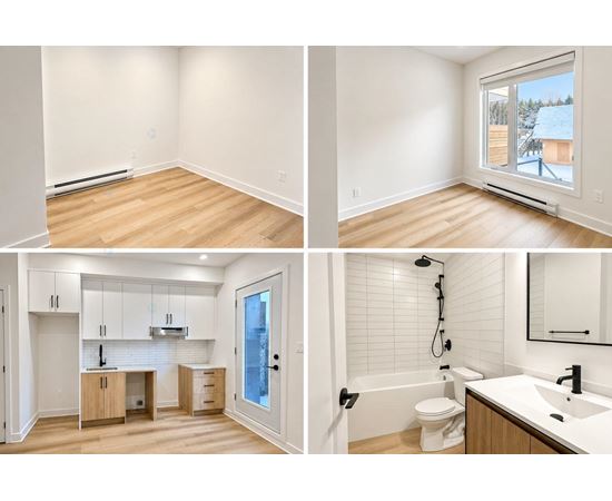 A white bathroom with a toilet, sink, and shower.