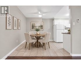 A dining room with a table set for four.