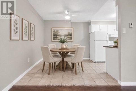 A dining room with a table set for four.