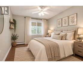A bedroom with a large bed, a ceiling fan, and a window with curtains.