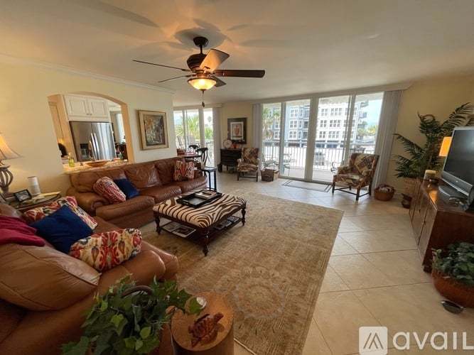 A living room with a brown sofa and a zebra print rug.