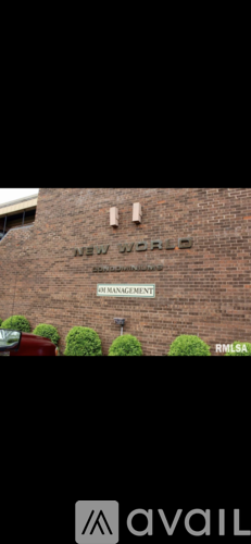 A brick wall with the words "New World" written on it.