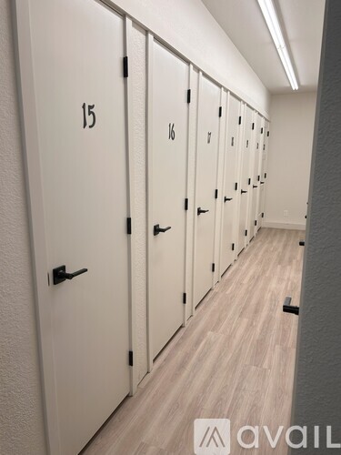 A row of white lockers numbered 15 to 18.