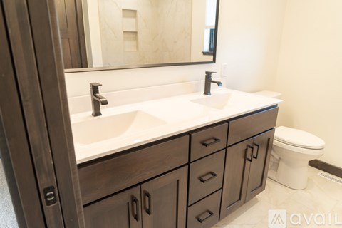 A bathroom with a sink and toilet.