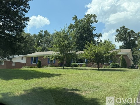 A house with a lawn in front of it.