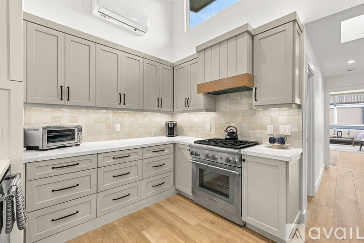 A kitchen with a stove top oven and a microwave.