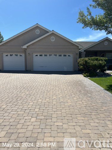 A house with a driveway in front of it.