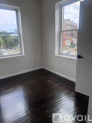 A room with a window and a door.
